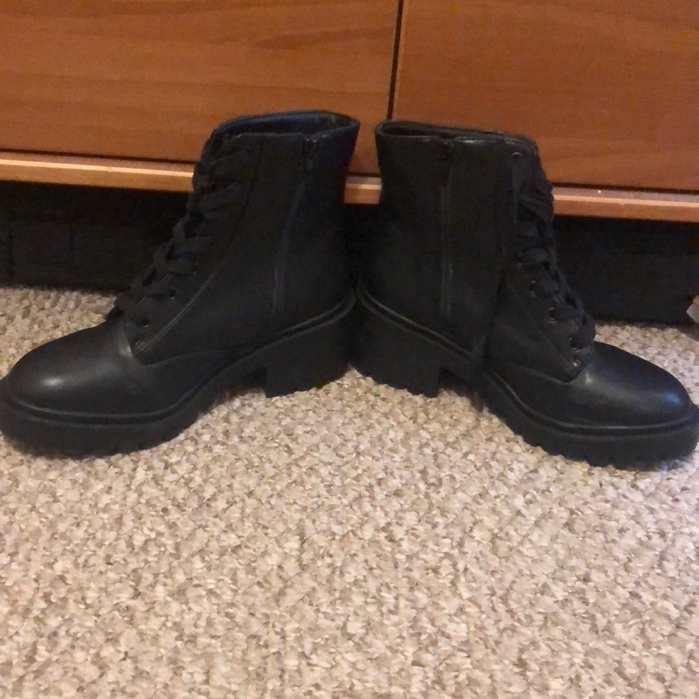Black combat-style boots.